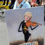 Grenfell May playing violin over coffin